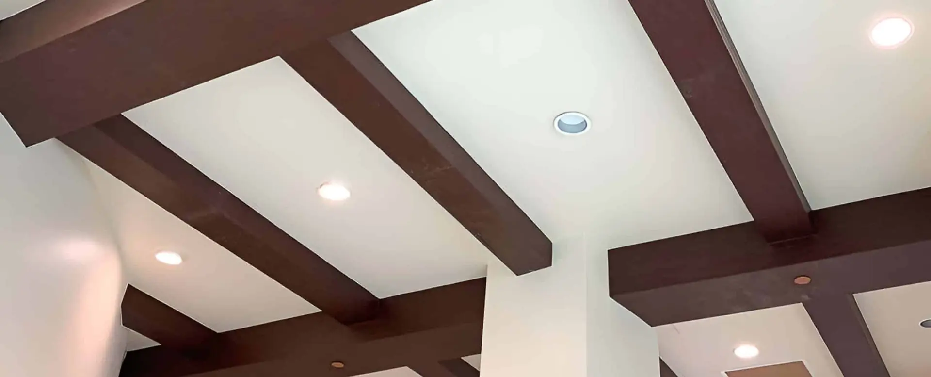 Ceiling with wooden beams and lights