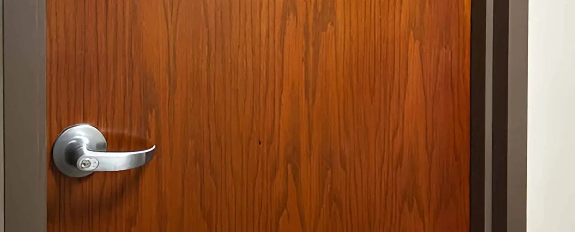 RAW-Portfolio-AdventHealth-BF-img002 Wooden door with silver handle